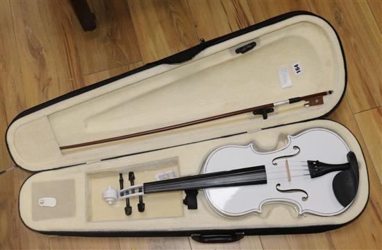 A white violin in case